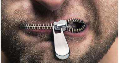 A close-up of a man's face featuring a zipper running across his lips, partially opened, creating a surreal and provocative visual effect.