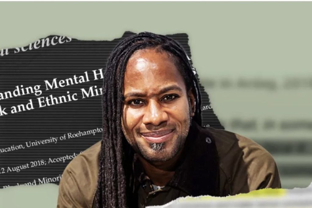 A smiling individual with long, dark hair styled in braids, wearing a jacket, in front of a blurred background featuring text related to mental health and ethnic minorities.